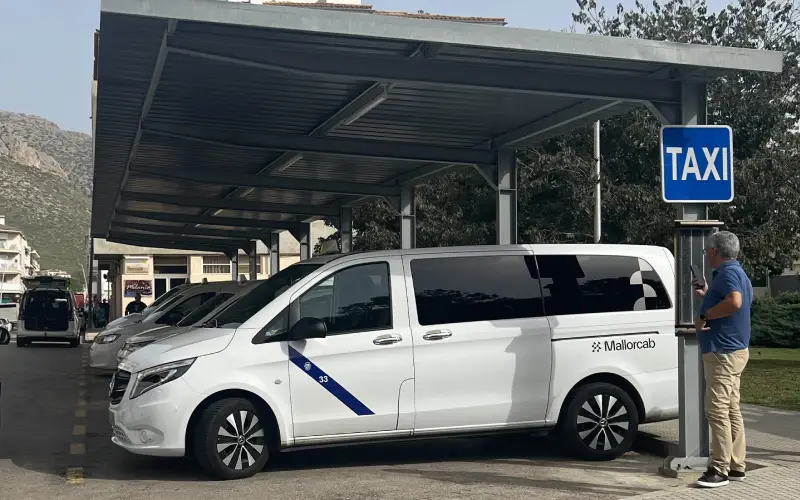 Official taxis parked at the taxi rank in Puerto Pollensa